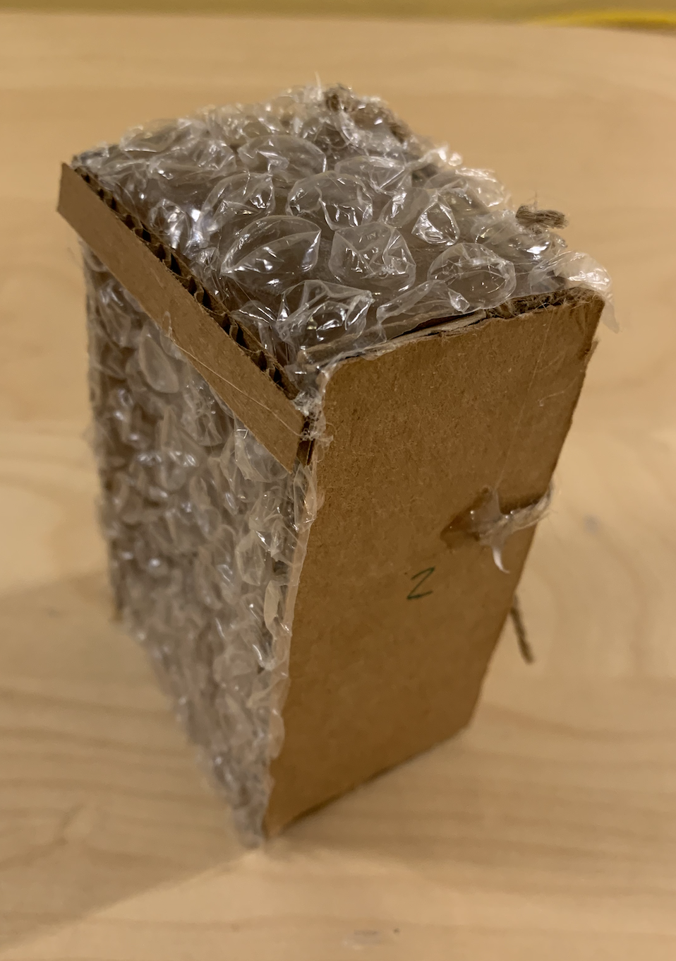 a cardboard prototype of an insulin pump holder